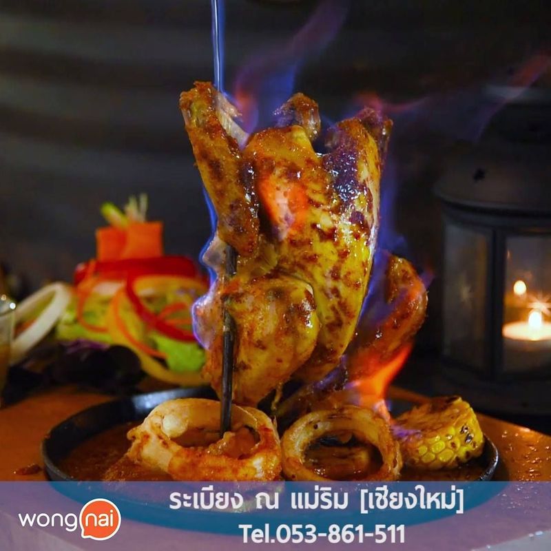 14K views · 284 reactions | ไก่อบภูเขาไฟ (399 บาท) เมนูอาหารไทยที่ได้รับการปรับปรุงขึ้นมาใหม่จากเมนูไก่อบฟางที่โด่งดังของไทย โดยการนำไก่ไปหมักกับเครื่องเทศจนซึมเข้าเนื้อเป็นอย่างดี จากนั้นจึงนำมาอบจนสุก ส่วนที่มาของคำว่าภูเขาไฟก็เห็นจะเป็นการราดด้วยเหล้าจุดไฟลงบนตัวไก่ จนดูเหมือนภูเขาไฟที่กำลังปะทุ ลิ้มลองได้ที่ร้าน ระเบียงน้ำแม่ริม อ่านต่อได้ที่ https://www.wongnai.com/articles/rabieng-na-maerim-cm | Story of North